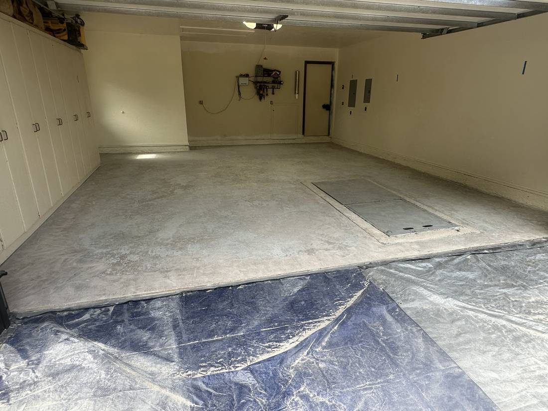 Garage floor before: bare, stained concrete